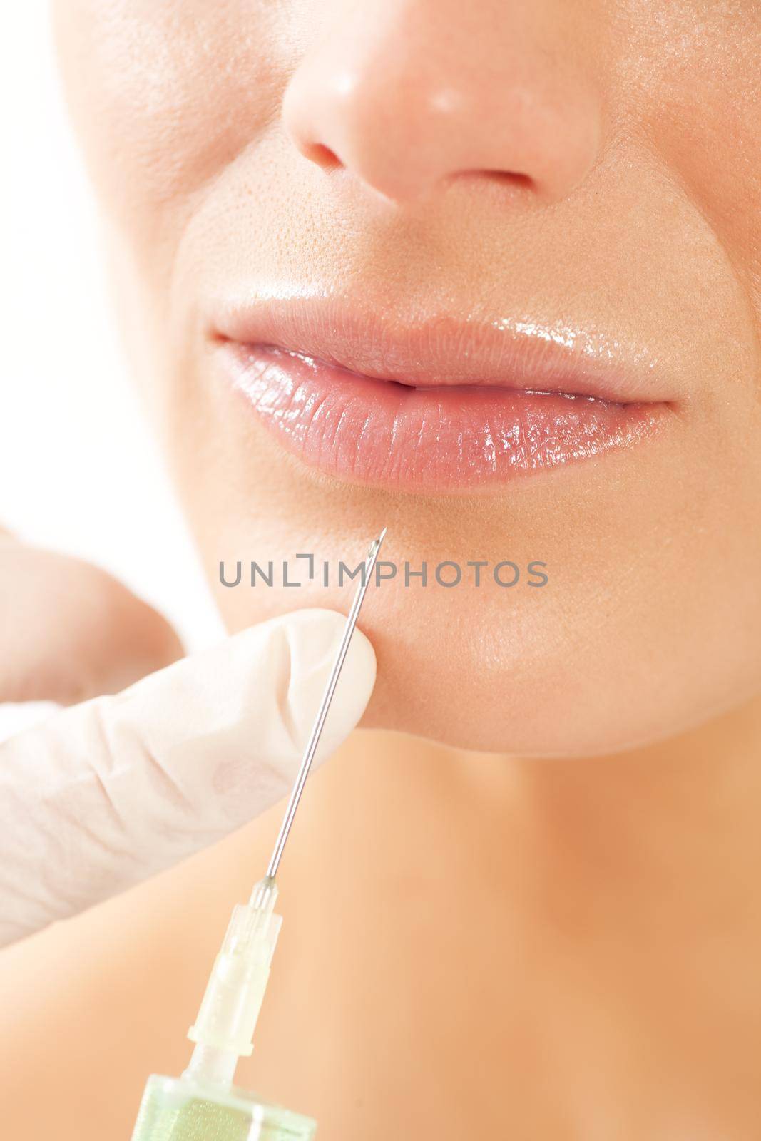 Botox - Age and beauty; a doctor is doing the injection