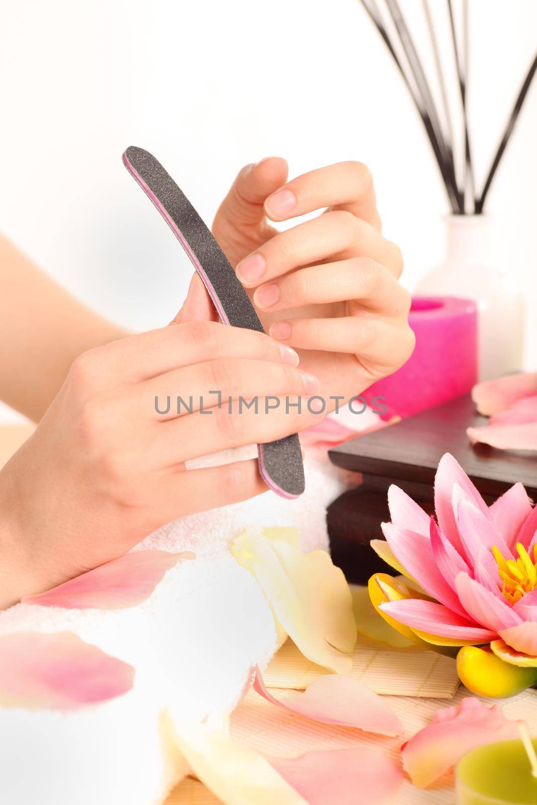 Woman doing manicure by Kzenon