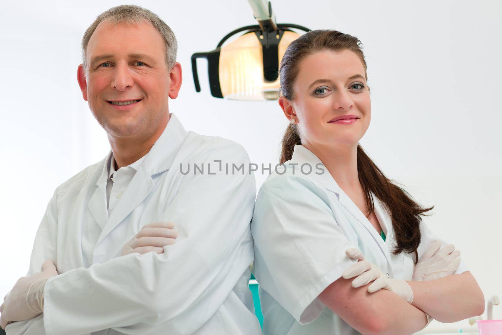 Dentists in their surgery by Kzenon