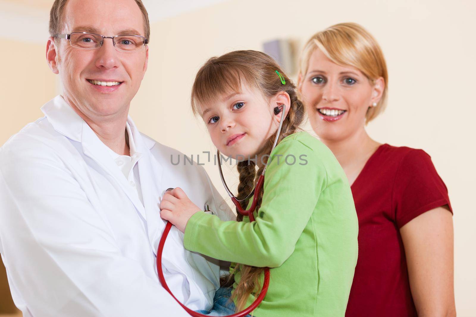 Pediatrician with family in his surgery by Kzenon