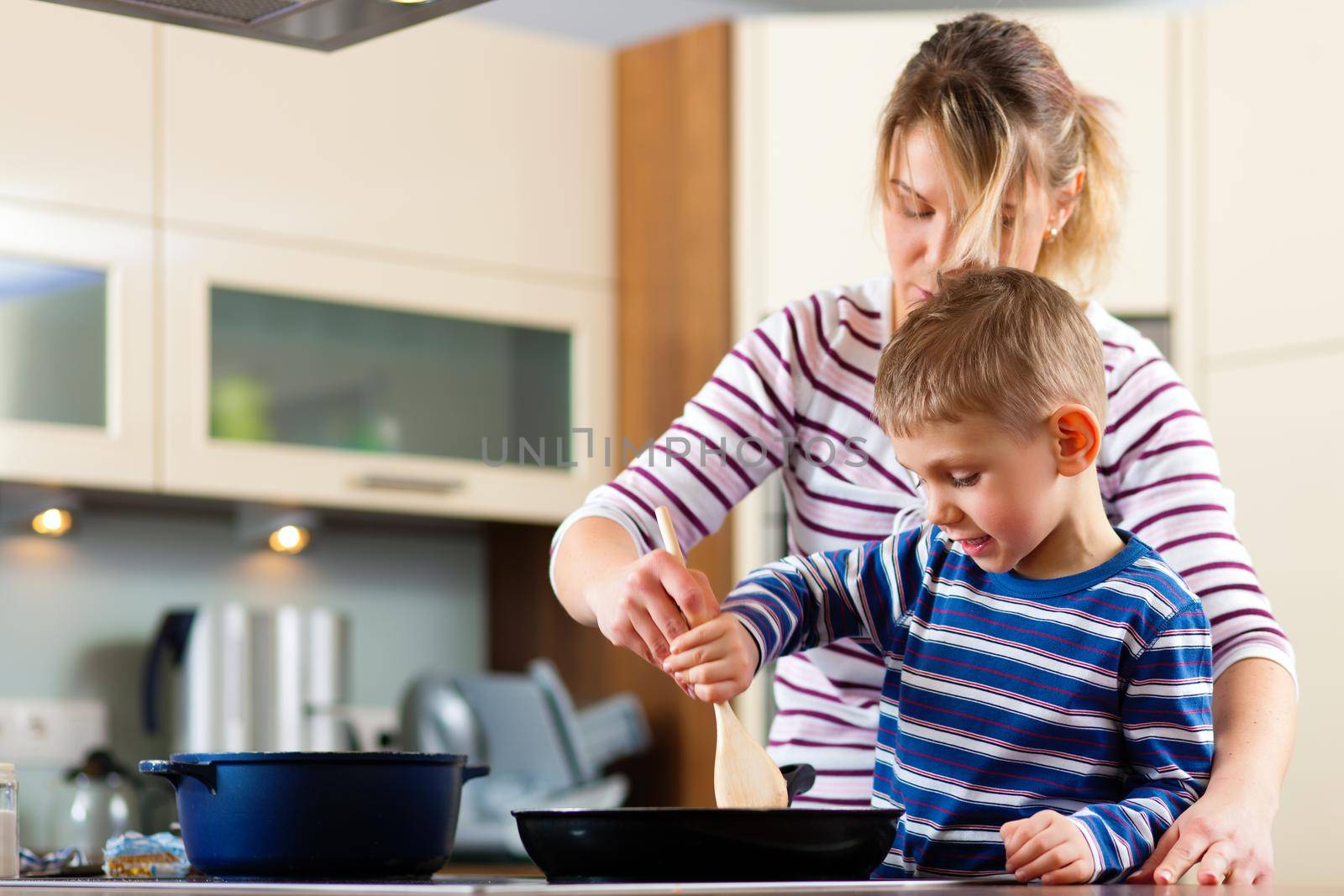 Family cooking in kitchen by Kzenon