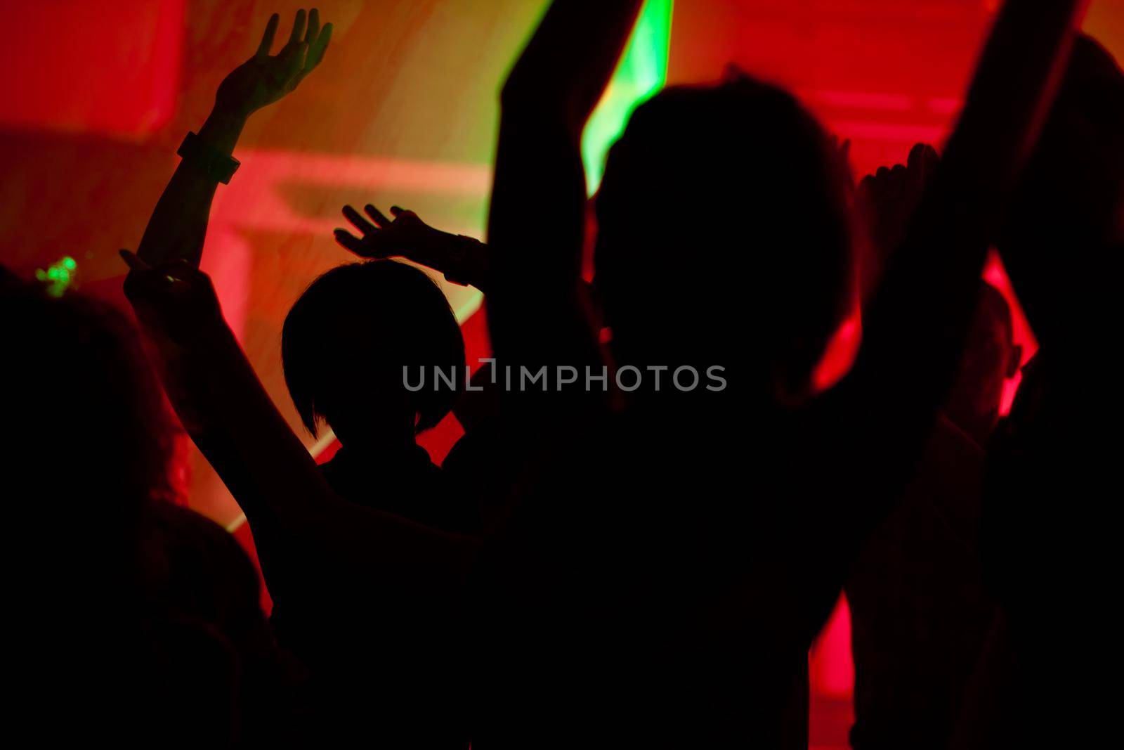People dancing in club with laser by Kzenon
