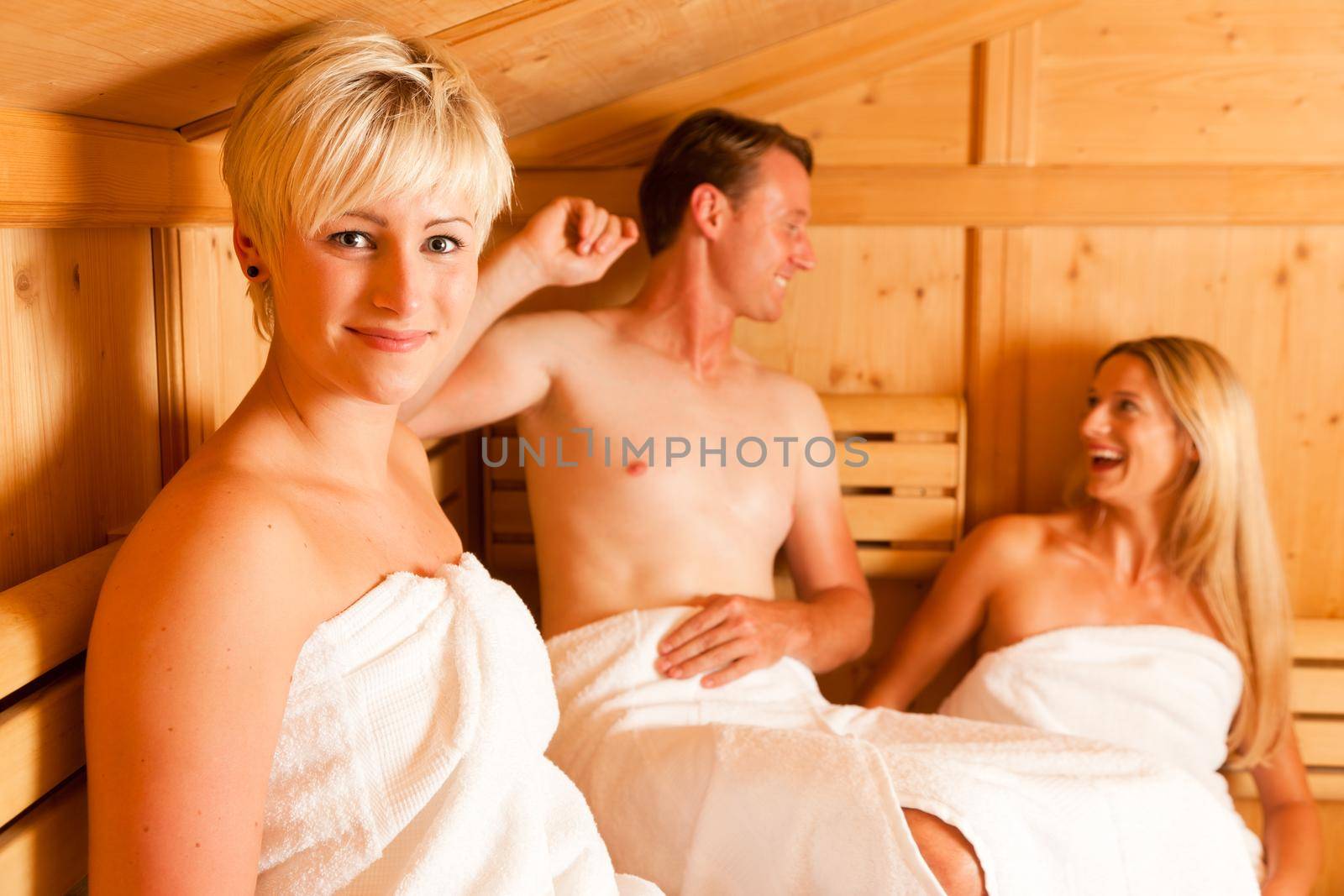 Three people in sauna by Kzenon