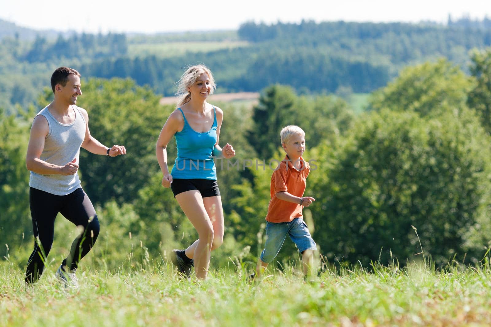 Family doing sports - jogging by Kzenon