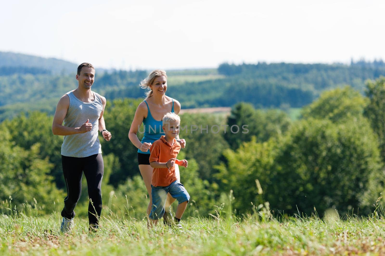 Family doing sports - jogging by Kzenon