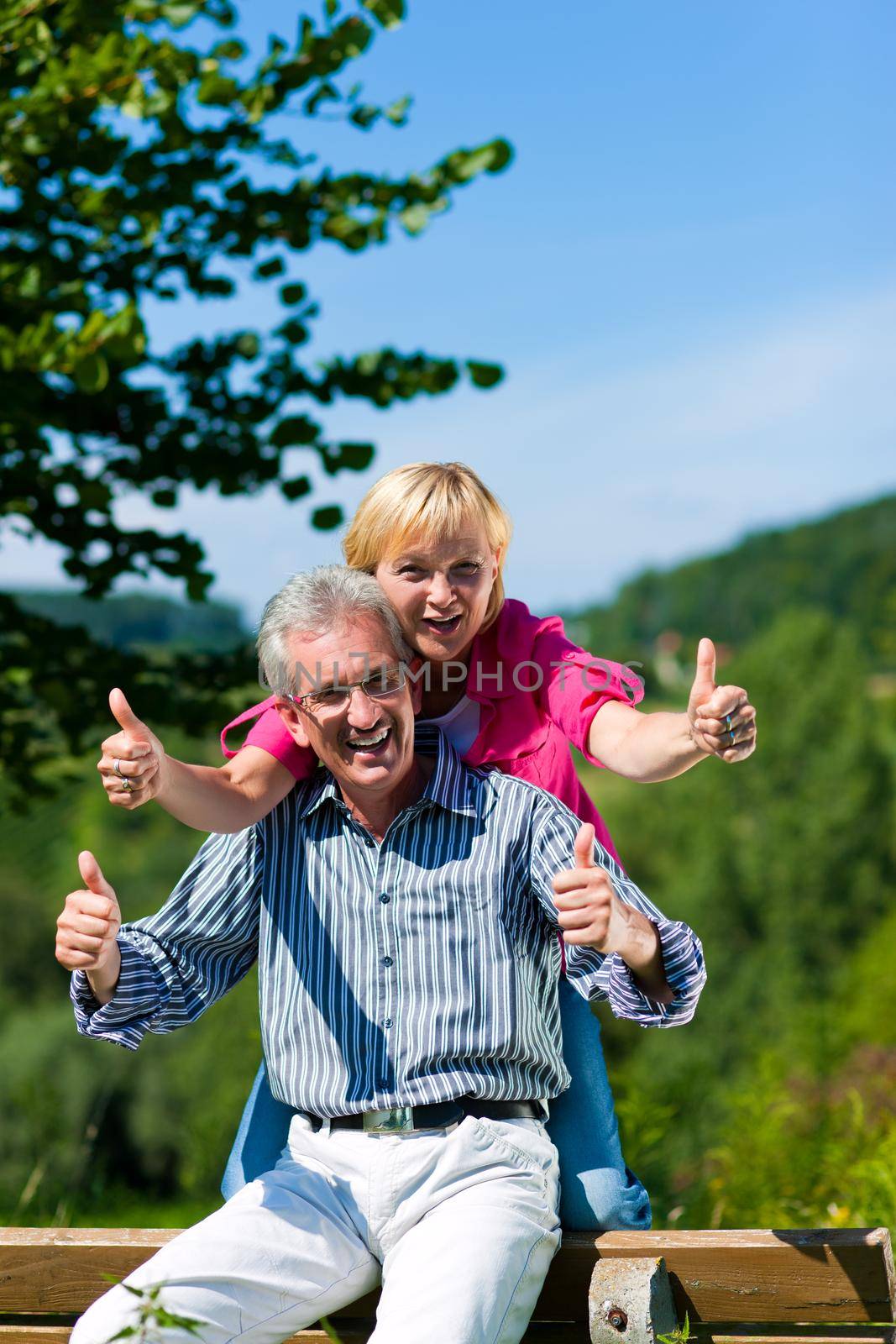 happy mature or senior couple having walk