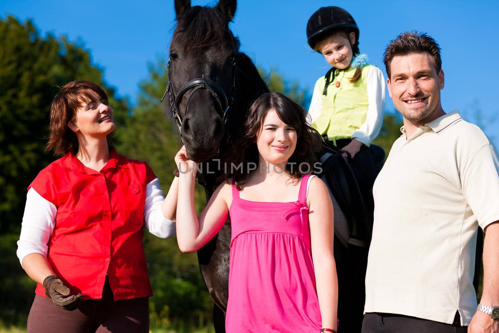 Family and children posing with horse by Kzenon