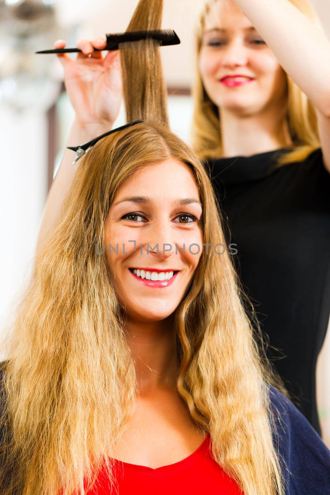 At the hairdresser - woman gets new hair colour or highlights