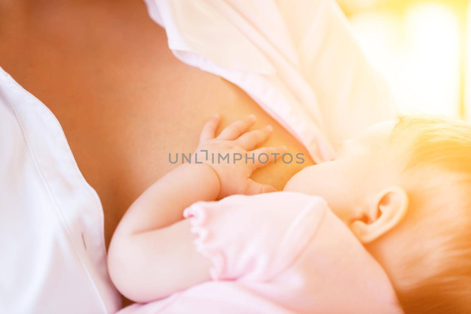 Mother nursing baby by breastfeeding by Kzenon