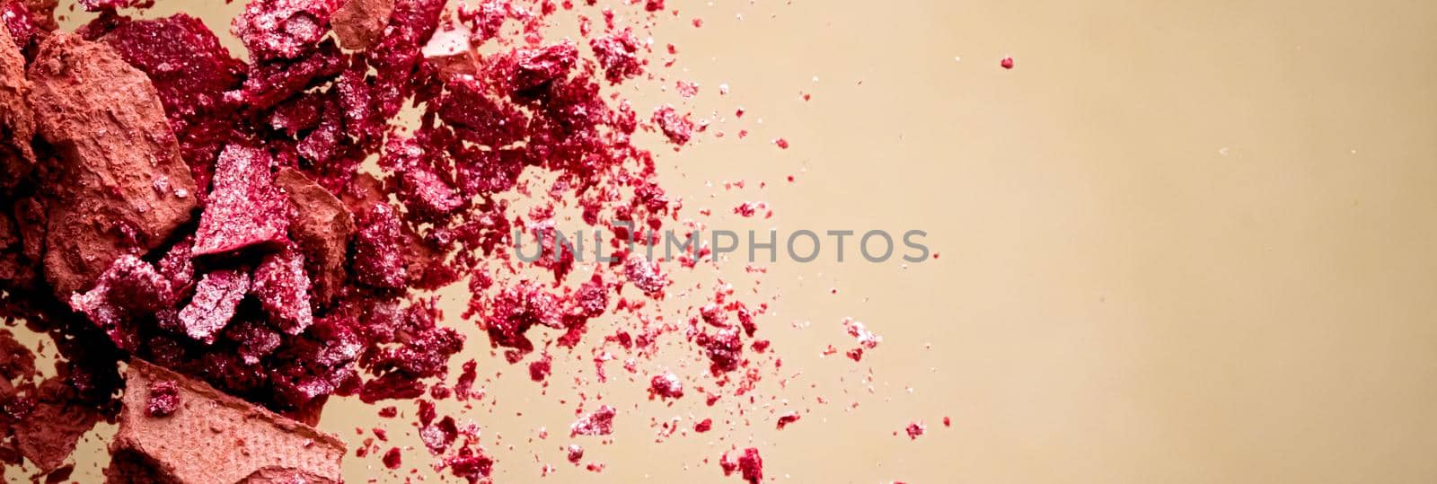 Crushed cosmetics, mineral organic eyeshadow, blush and cosmetic powder isolated on golden background, makeup and beauty banner, flatlay design.