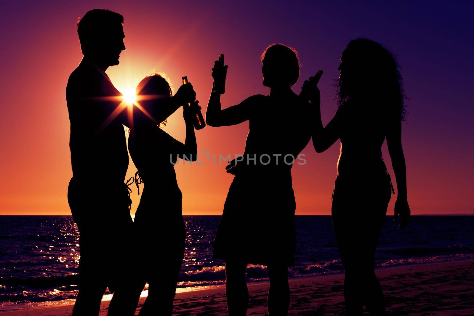 People having party at beach with drinks by Kzenon