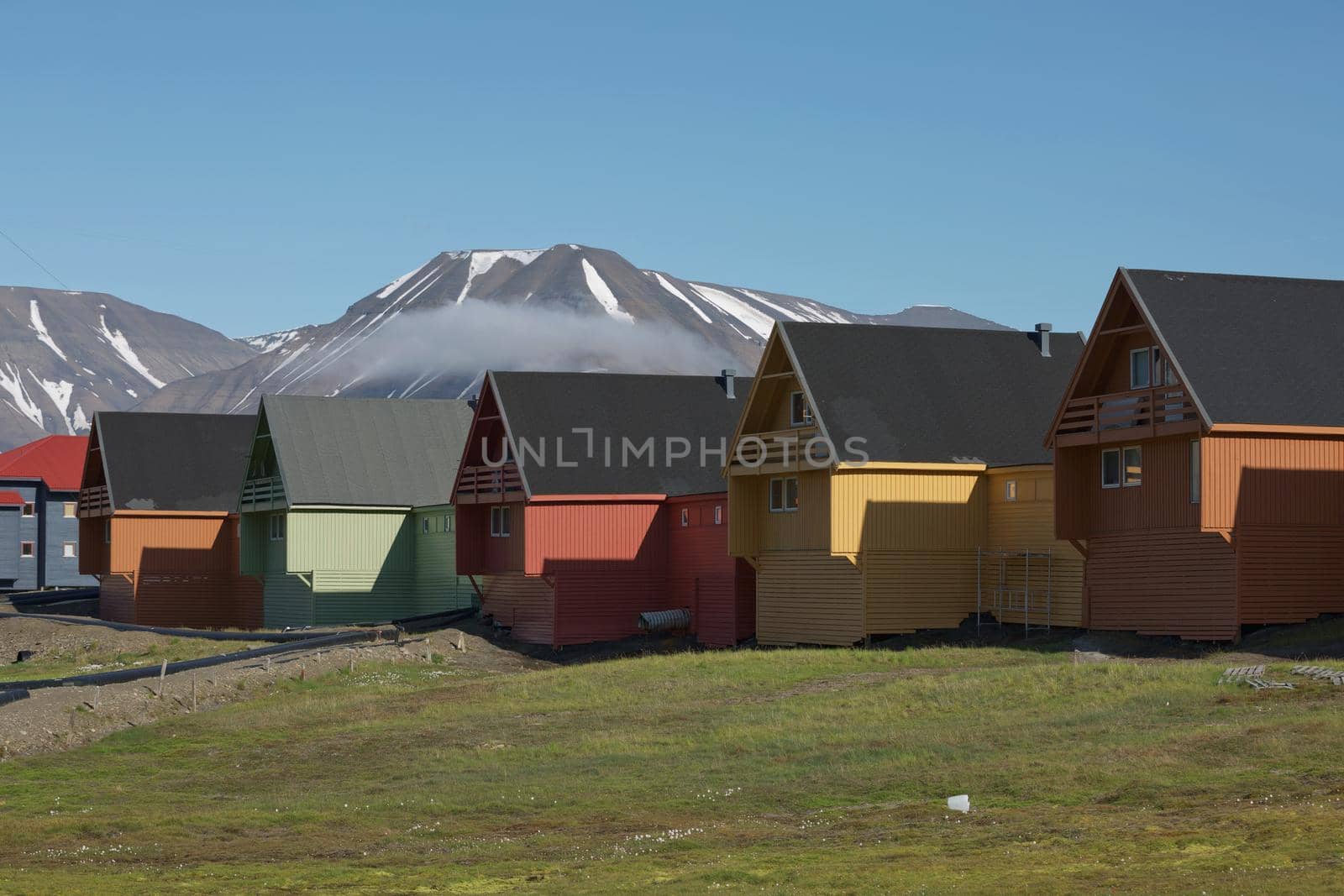 Traditional colorful wooden houses on a sunny day in Longyearbyen Svalbard.