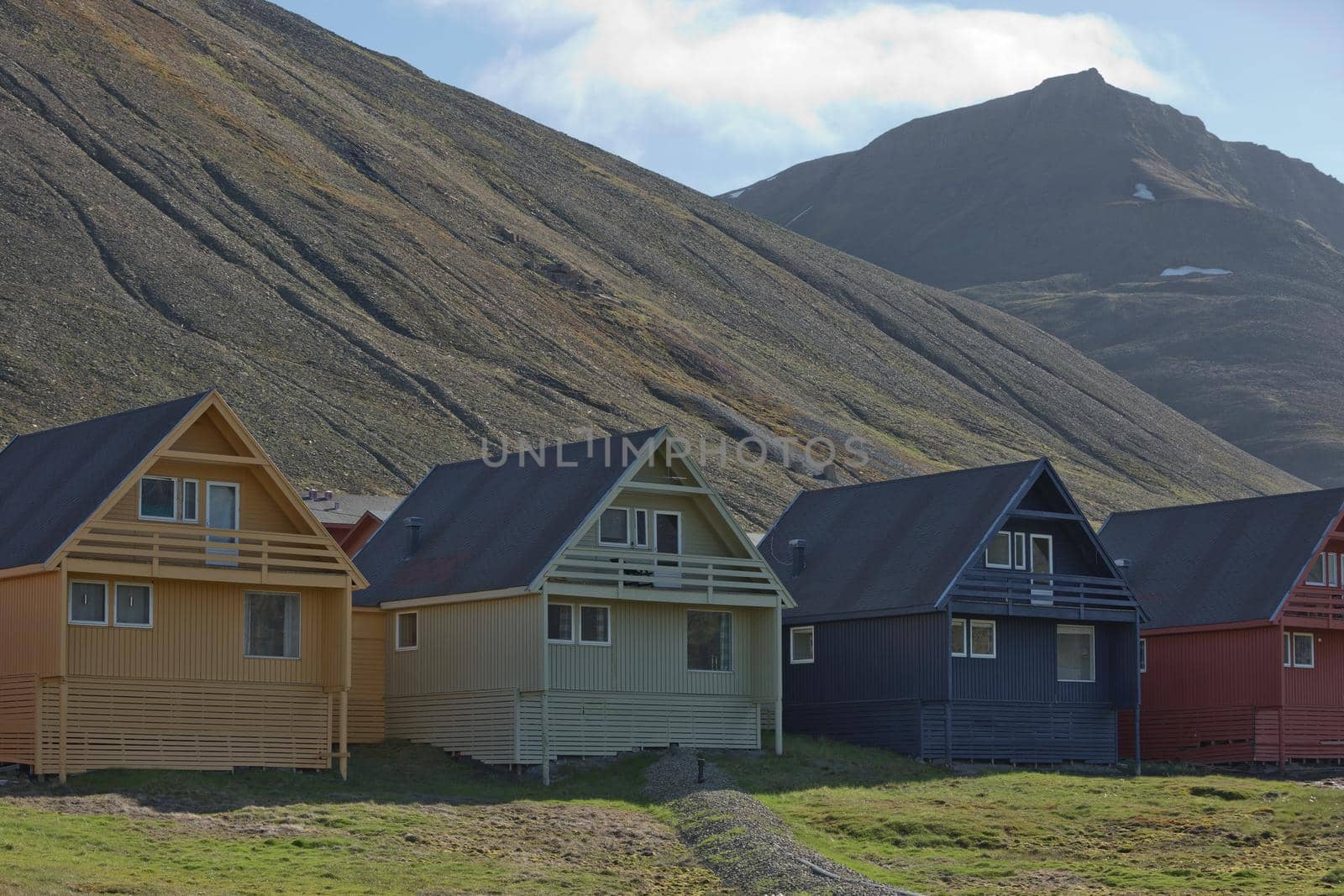 Traditional colorful wooden houses on a sunny day in Longyearbyen Svalbard by wondry