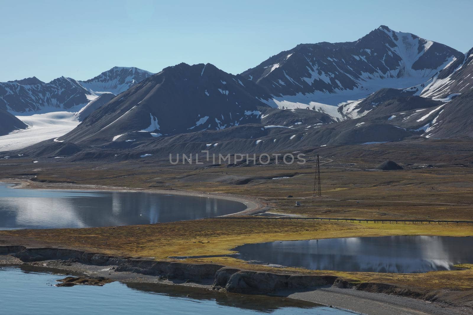 Mountains, glaciers and coastline landscape close to a village called "Ny-Ålesund" located at 79 degree North on Spitsbergen.