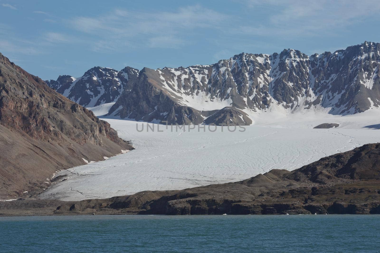 Mountains, glaciers and coastline landscape close to a village called "Ny-Ålesund" located at 79 degree North on Spitsbergen.