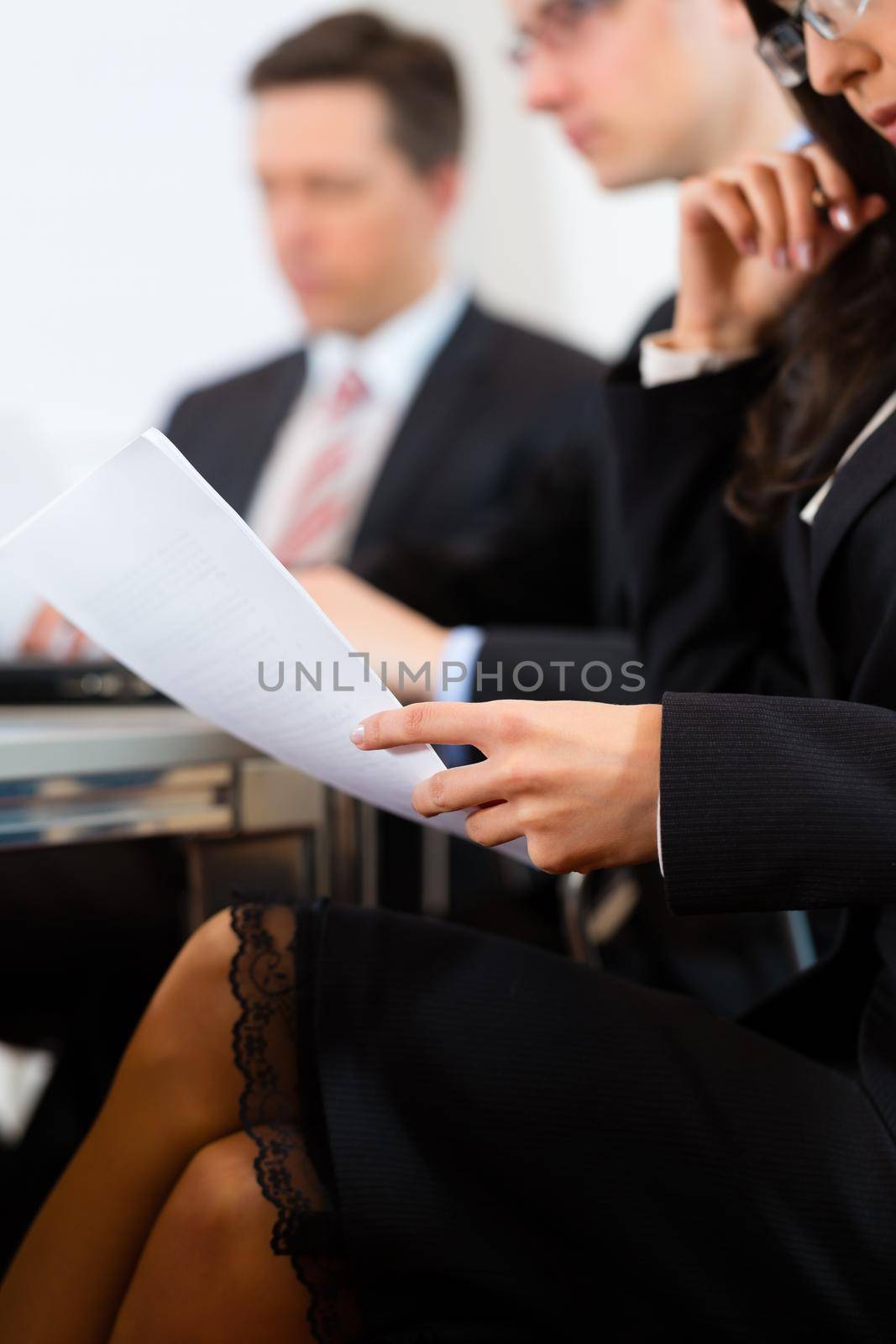 Business people sitting in a meeting or workshop in an office