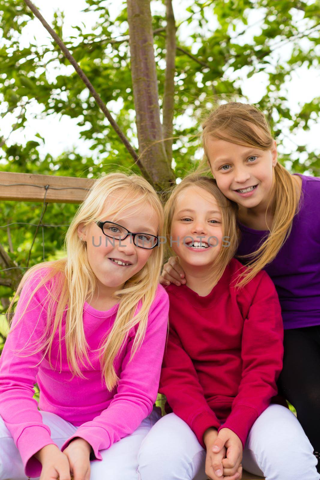 Happy children in the garden on a summer day