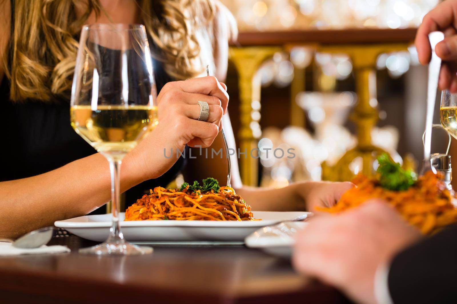 happy couple have a romantic date in restaurant by Kzenon