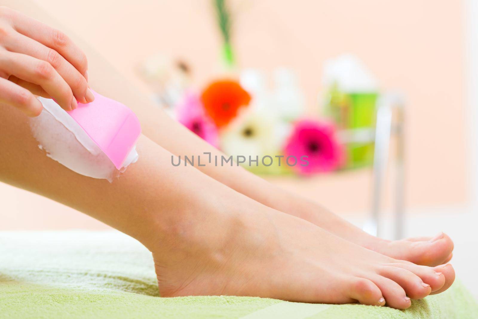 Woman in Spa getting a hair removal by Kzenon