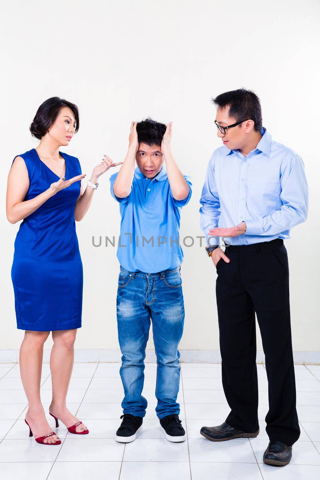 Young Chinese boy suffering from parents divorce by Kzenon