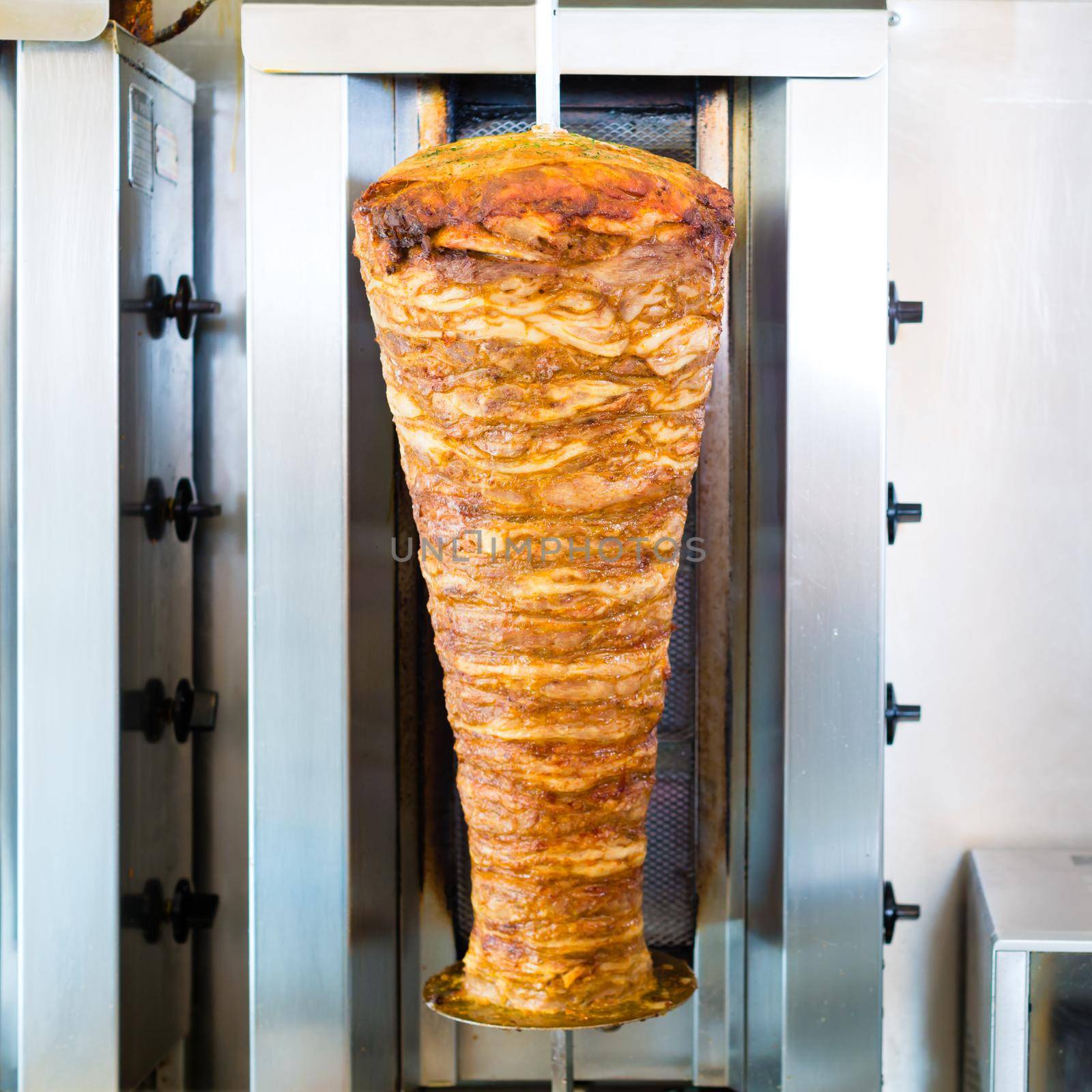 Doner kebab - hot and fresh meat skewer in Turkish fast food eatery