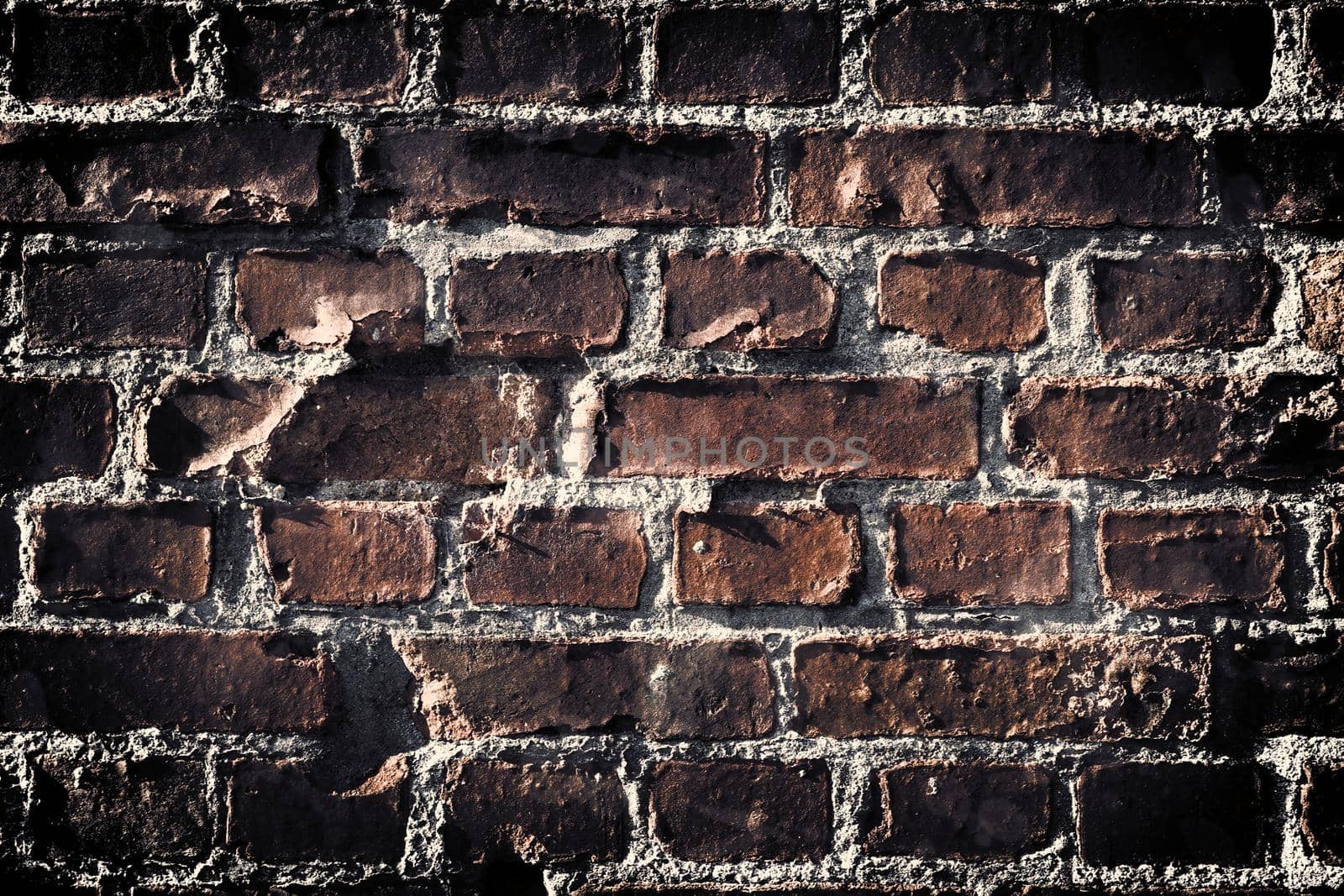 Aged and weathered old brick wall texture in a retro vintage design  by MP_foto71