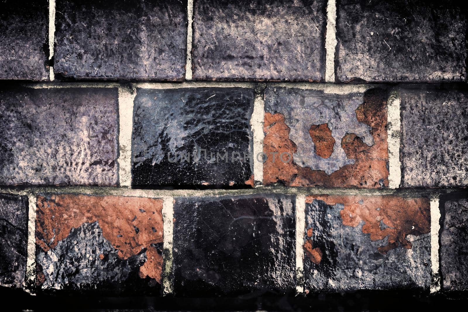 Aged and weathered old brick wall texture in a retro vintage design  by MP_foto71