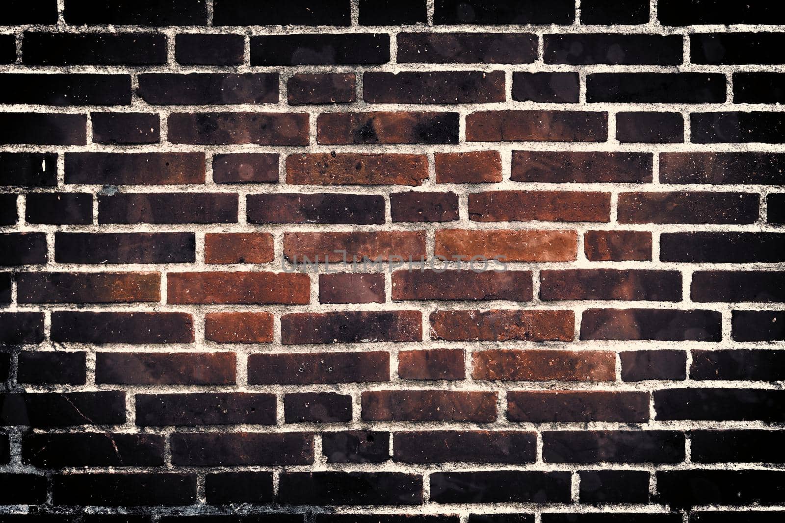 Aged and weathered old brick wall texture in a retro vintage design  by MP_foto71