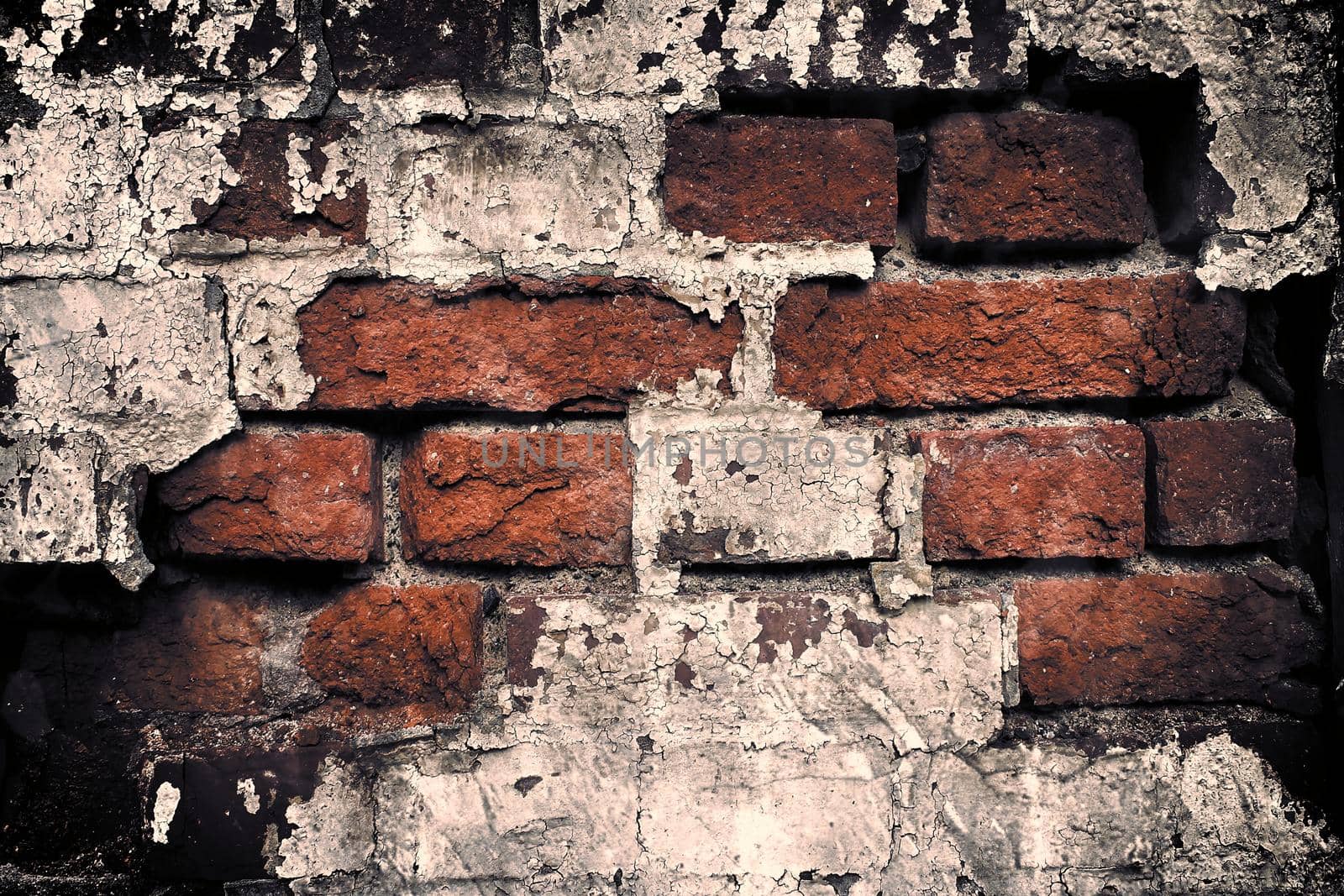 Aged and weathered old brick wall texture in a retro vintage design  by MP_foto71