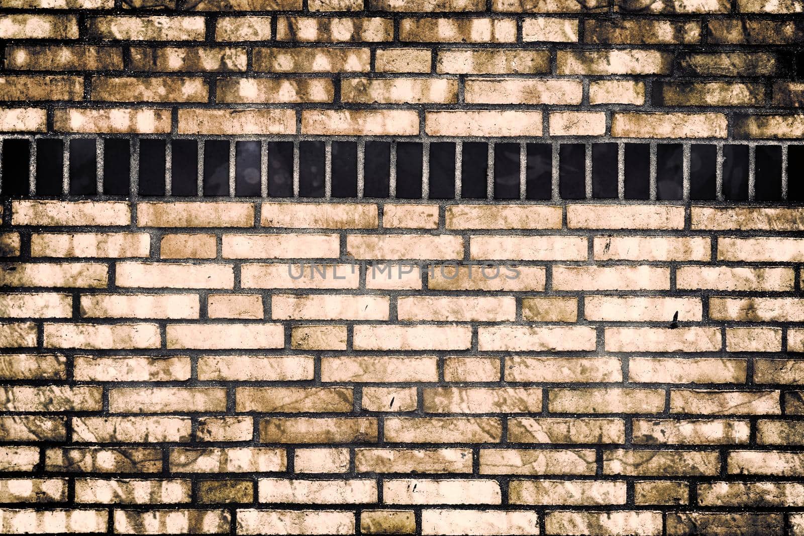 Aged and weathered old brick wall texture in a retro vintage design  by MP_foto71