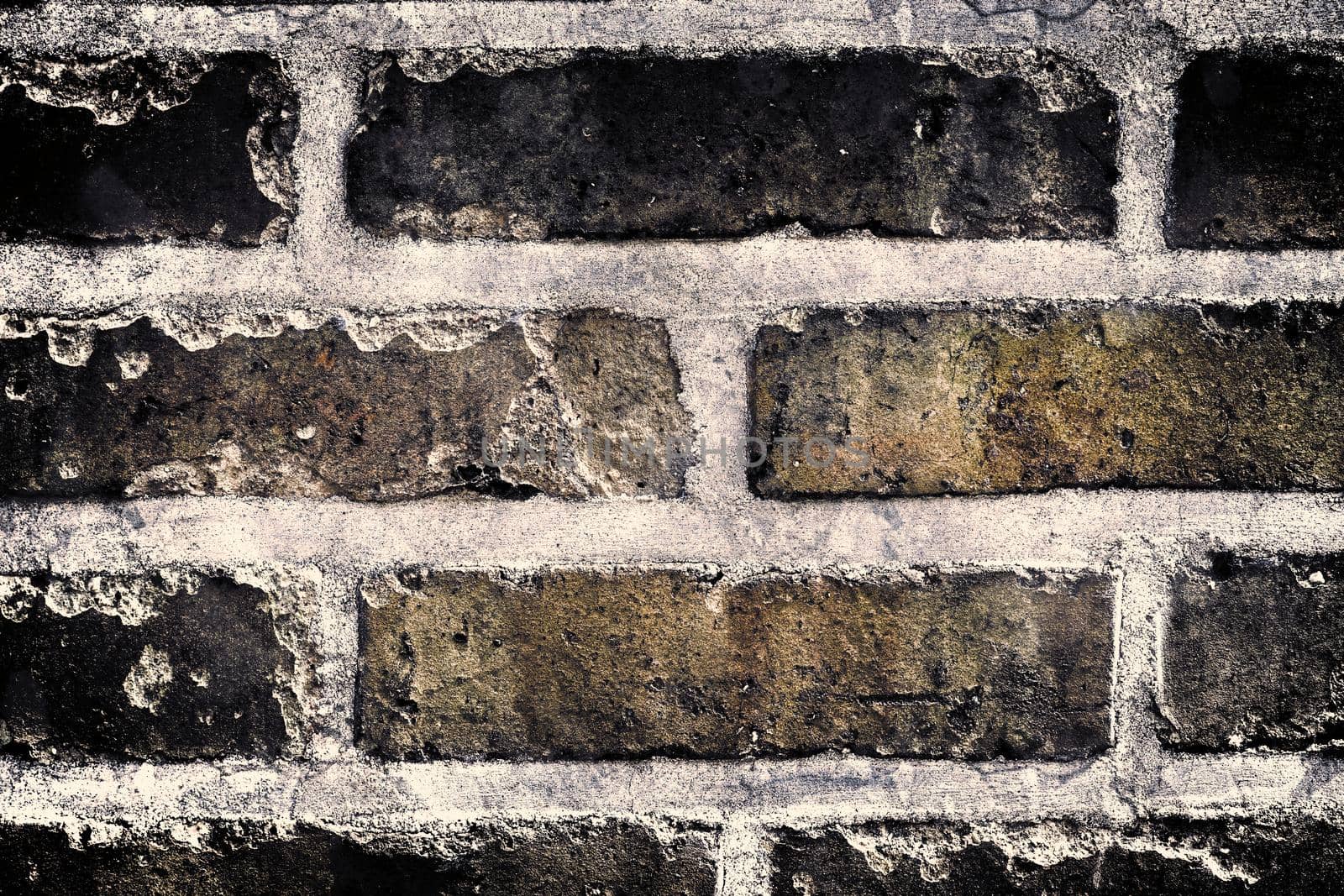 Aged and weathered old brick wall texture in a retro vintage design  by MP_foto71