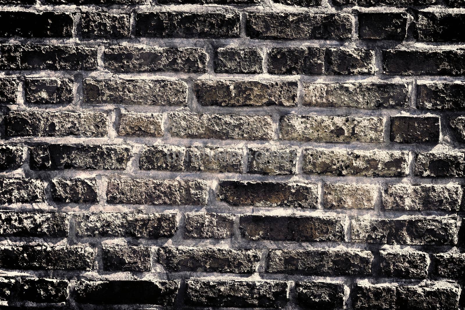 Aged and weathered old brick wall texture in a vintage retro design 