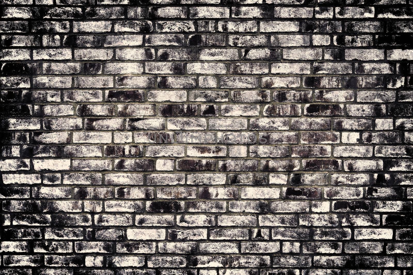 Aged and weathered old brick wall texture in a retro vintage design  by MP_foto71