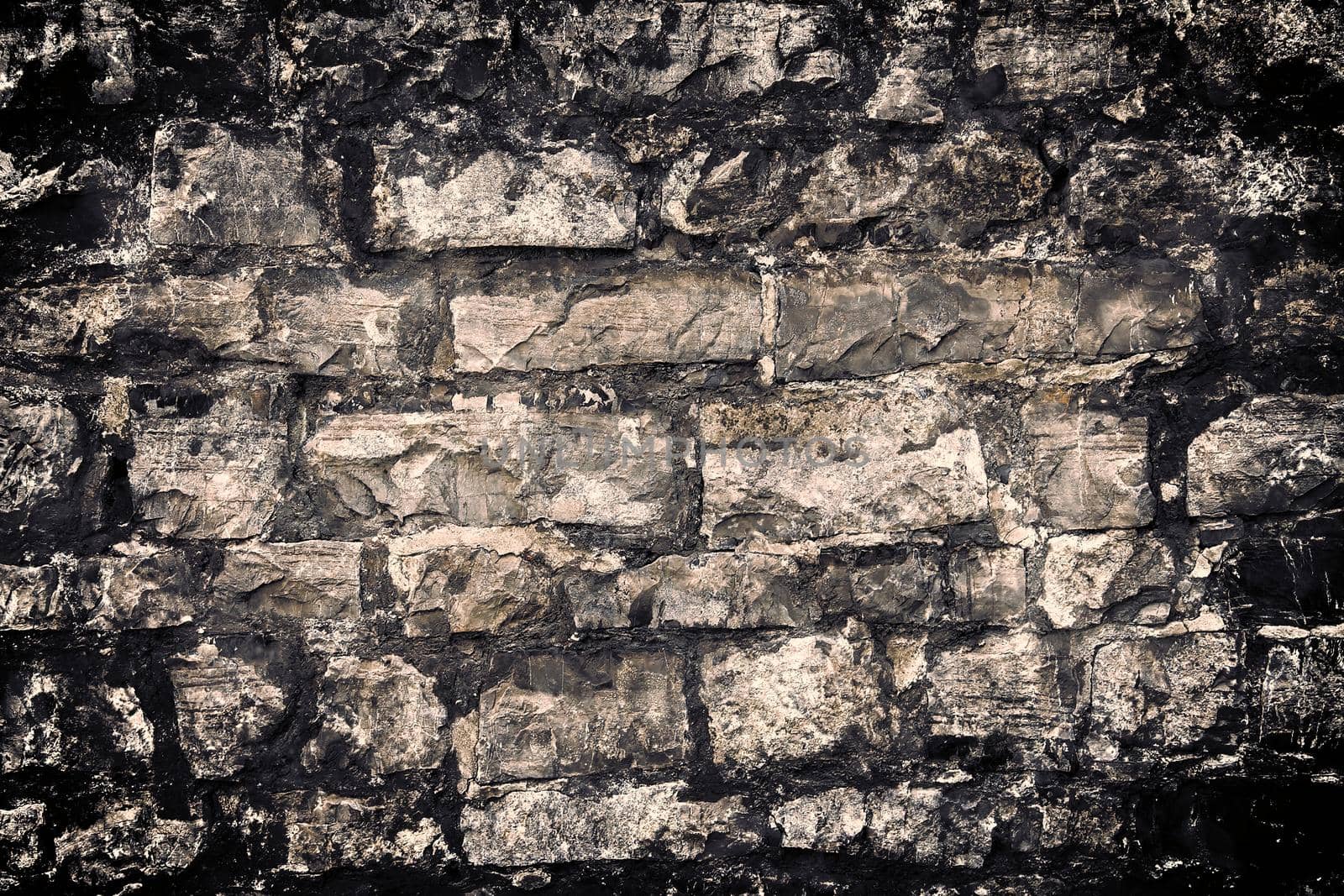 Aged and weathered old brick wall texture in a retro vintage design  by MP_foto71