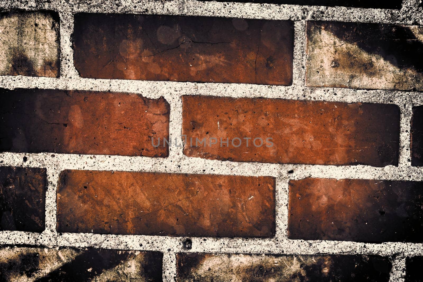 Aged and weathered old brick wall texture in a retro vintage design  by MP_foto71