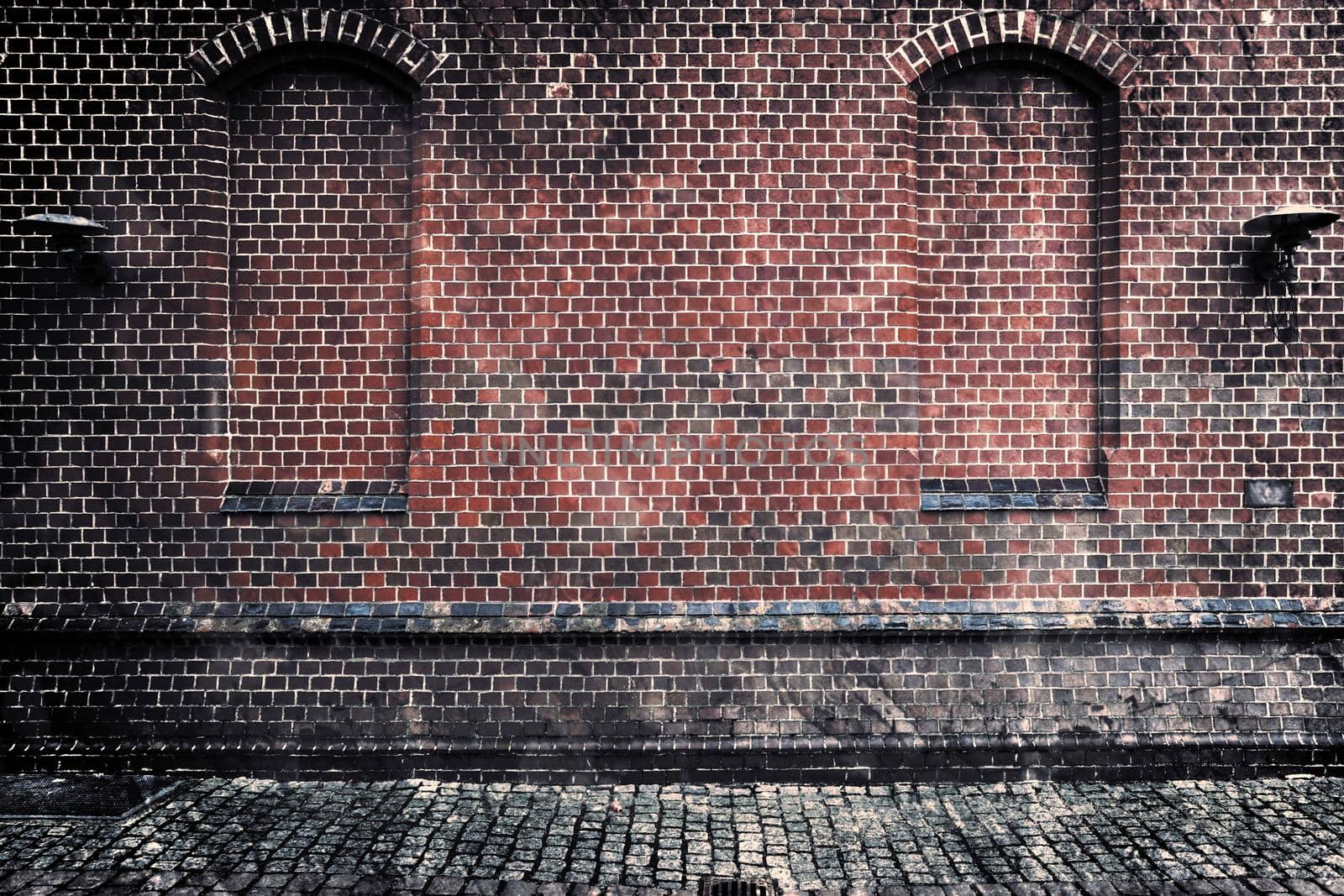 Aged and weathered old brick wall texture in a retro vintage design  by MP_foto71