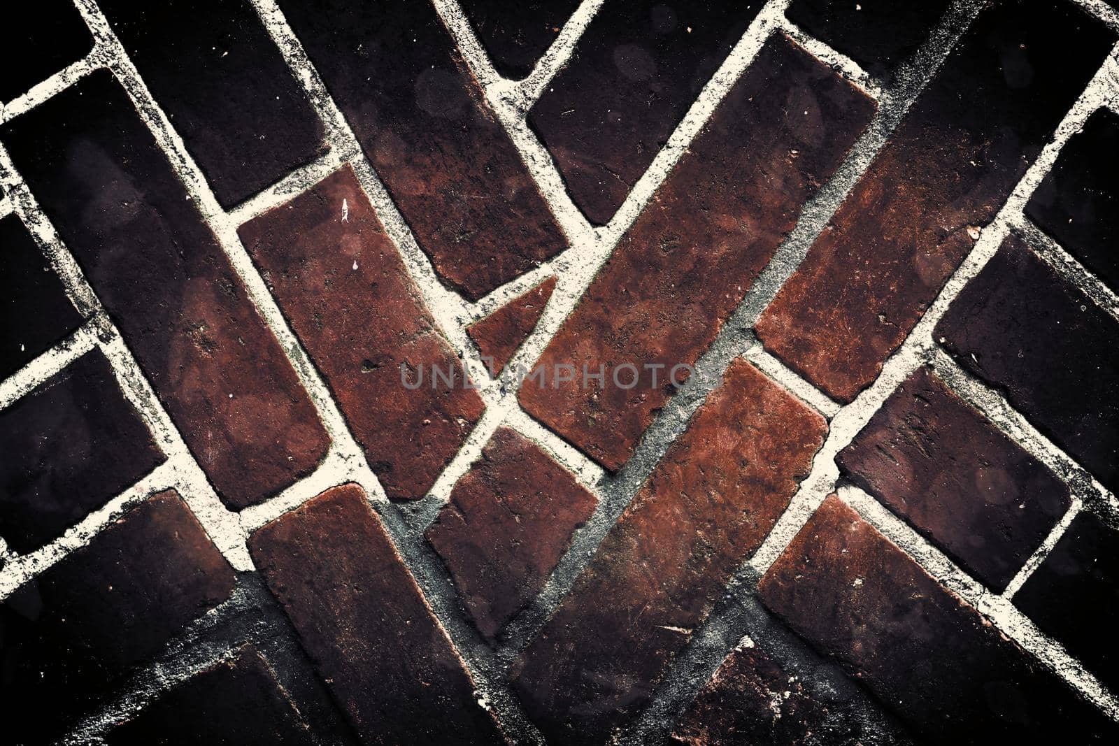 Aged and weathered old brick wall texture in a retro vintage design  by MP_foto71