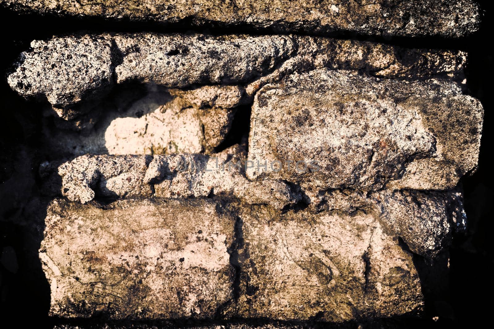 Aged and weathered old brick wall texture in a retro vintage design  by MP_foto71