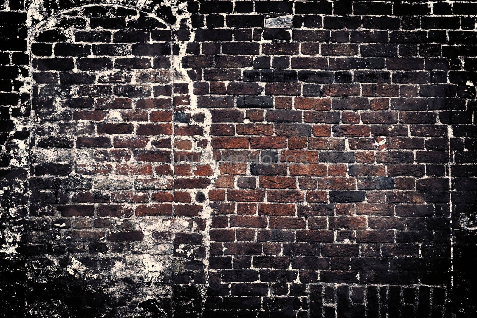 Aged and weathered old brick wall texture in a retro vintage design  by MP_foto71