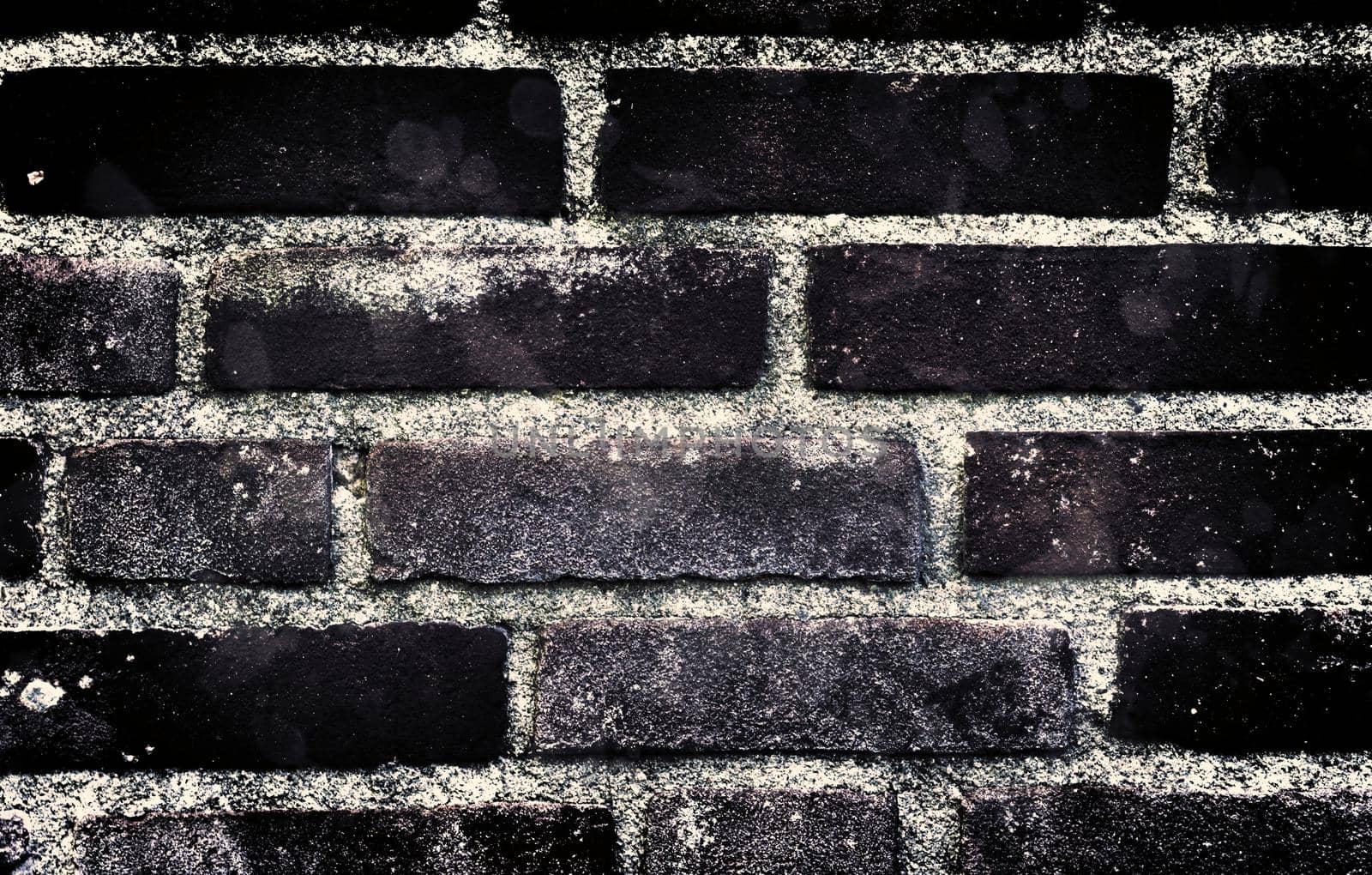 Aged and weathered old brick wall texture in a vintage retro design 