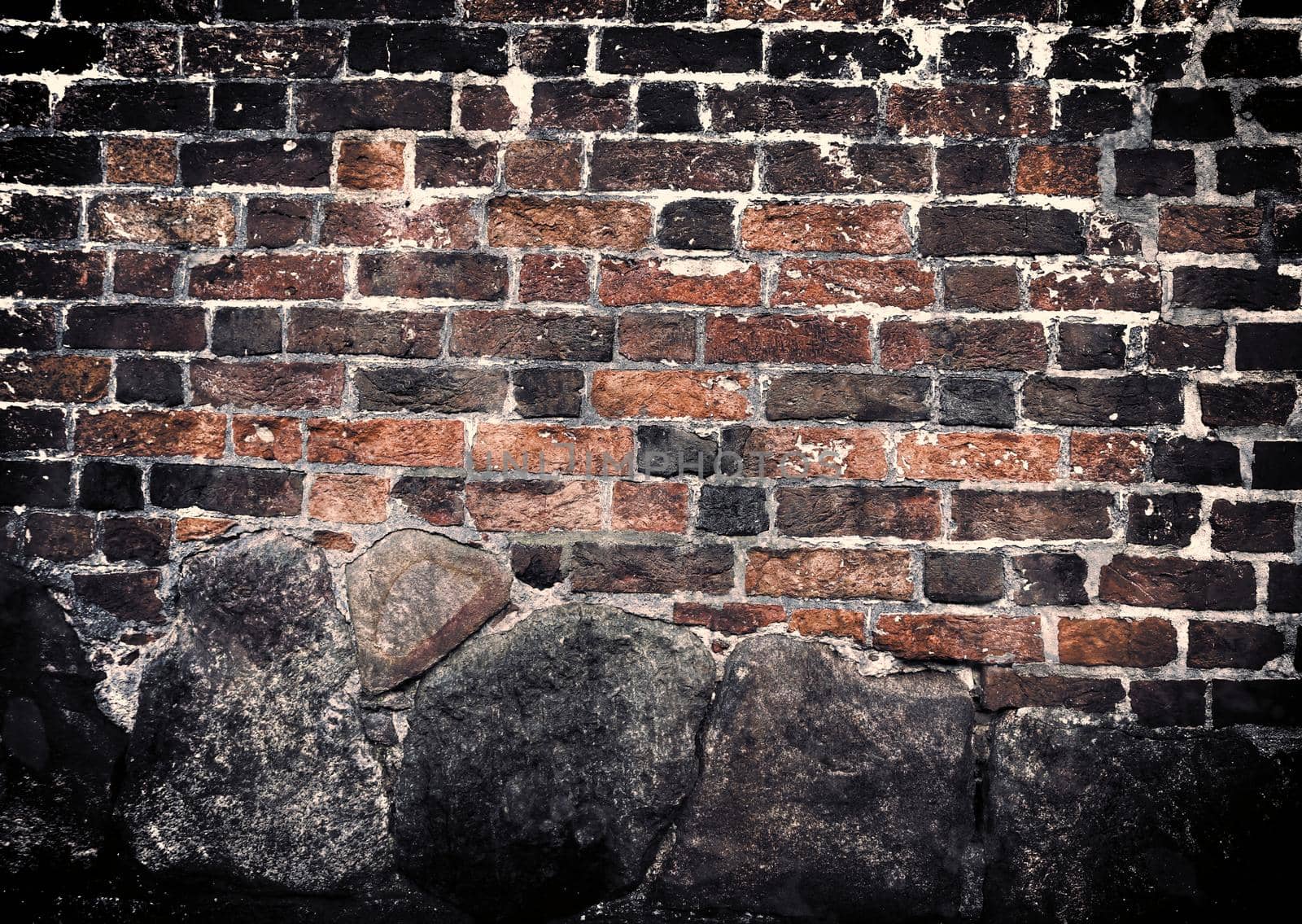 Aged and weathered old brick wall texture in a retro vintage design  by MP_foto71