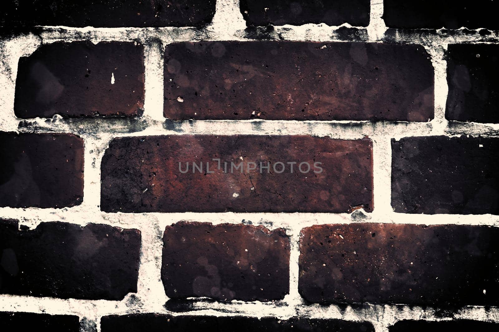 Aged and weathered old brick wall texture in a retro vintage design  by MP_foto71