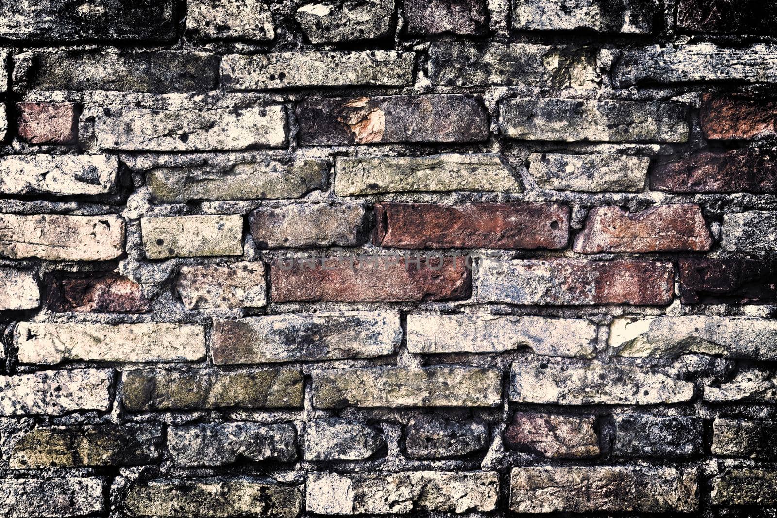 Aged and weathered old brick wall texture in a retro vintage design  by MP_foto71