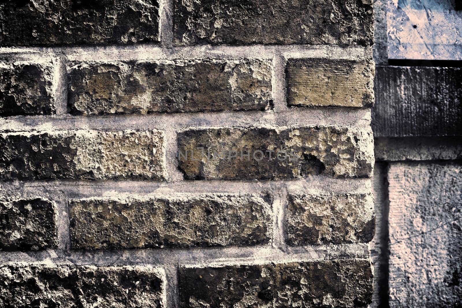 Aged and weathered old brick wall texture in a retro vintage design  by MP_foto71