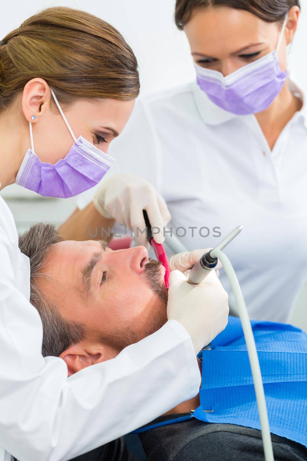 Patient with Dentist - dental treatment by Kzenon
