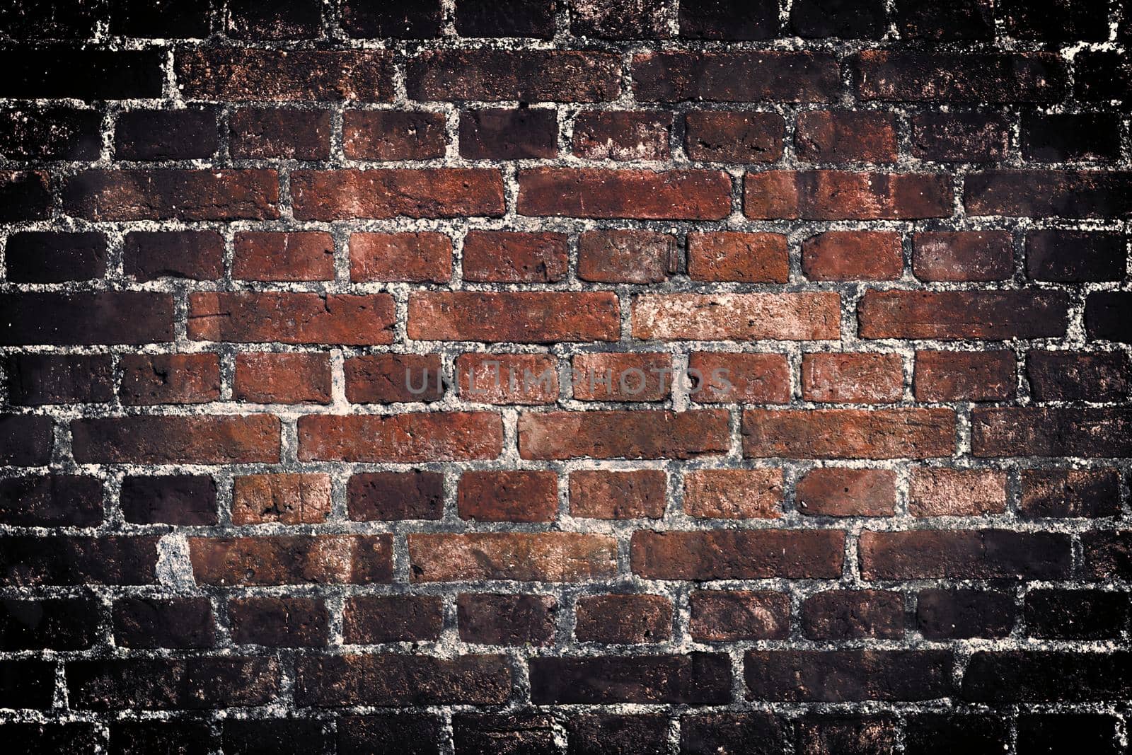 Aged and weathered old brick wall texture in a retro vintage design  by MP_foto71