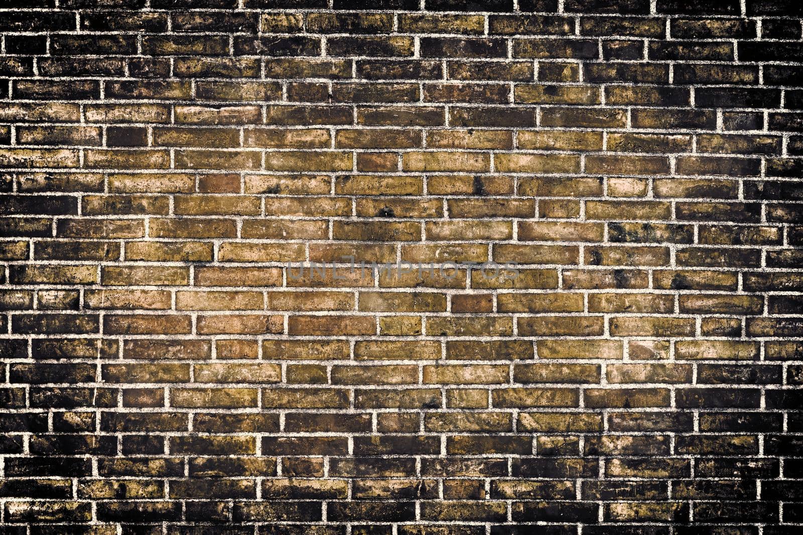 Aged and weathered old brick wall texture in a retro vintage design  by MP_foto71