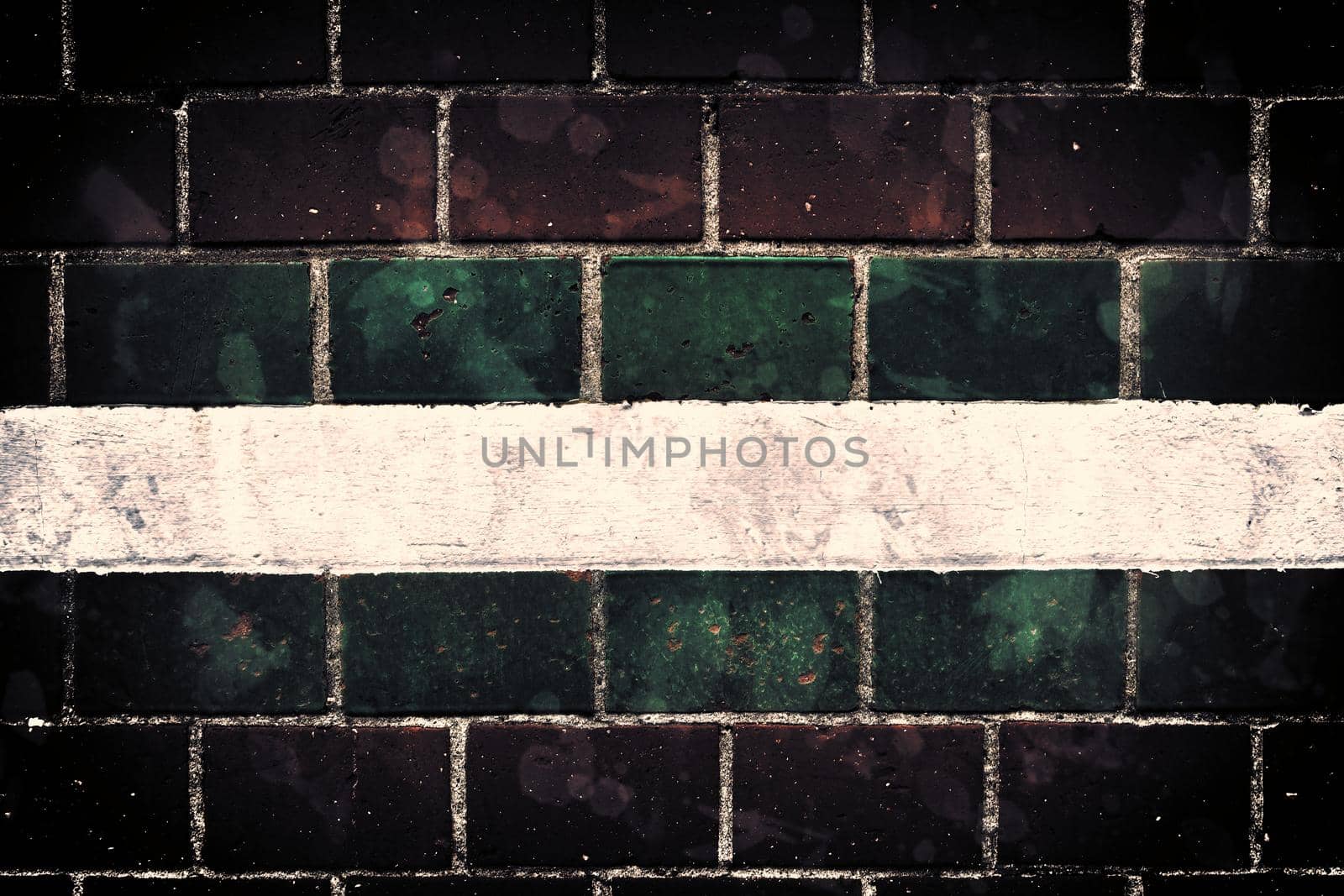 Aged and weathered old brick wall texture in a retro vintage design  by MP_foto71