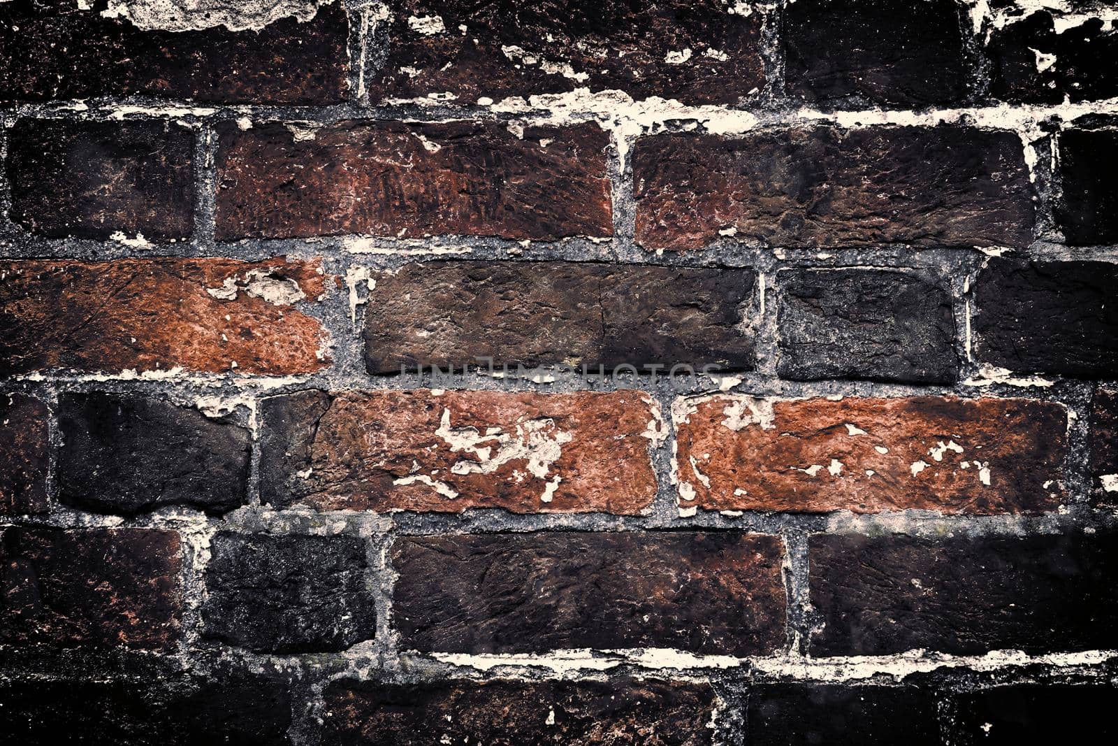 Aged and weathered old brick wall texture in a vintage retro design 