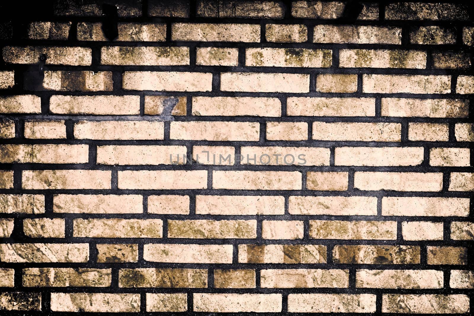 Aged and weathered old brick wall texture in a retro vintage design  by MP_foto71